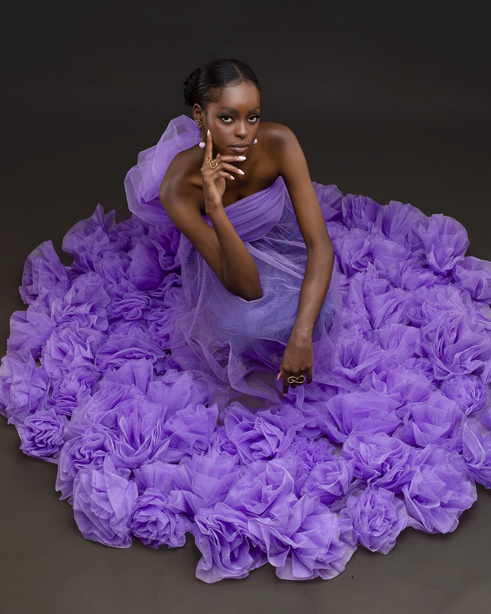 Model in a lilac tulle gown with a rosette skirt